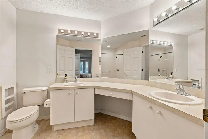 Primary en-suite bathroom with dual sinks