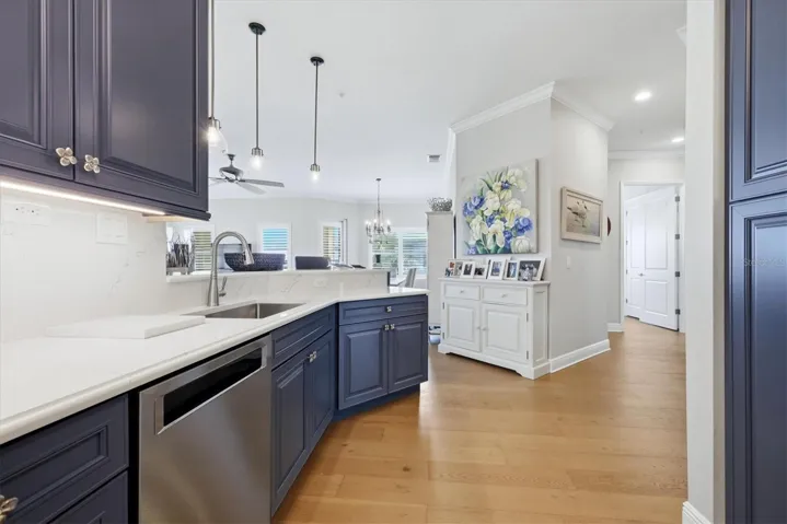 Kitchen has custom cabinetry, quartz countertops.