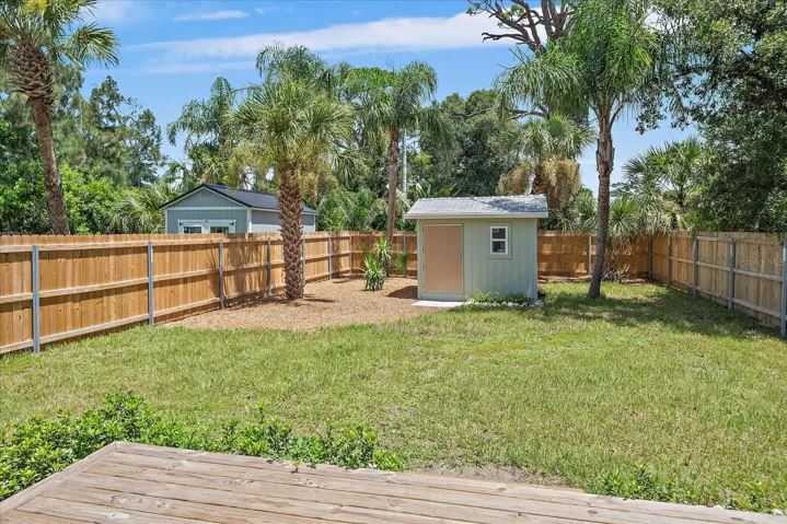 Backyard with deck off the primary bedroom &amp; shed with electric