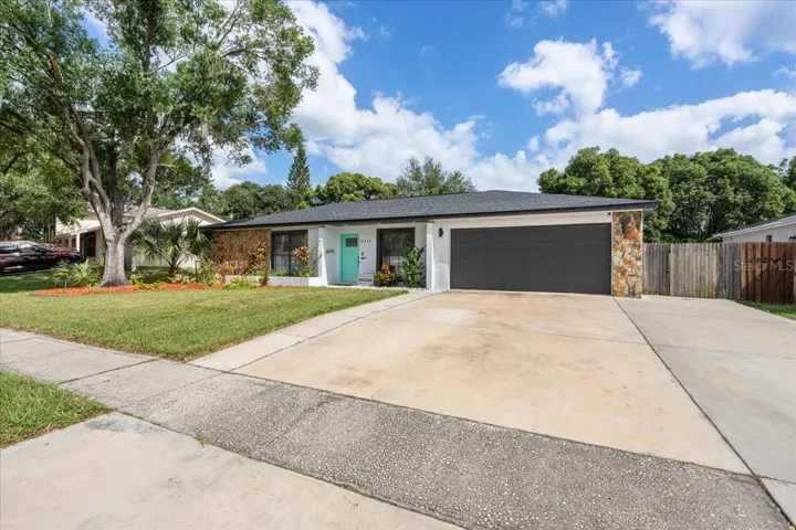 Front with 3 car driveway