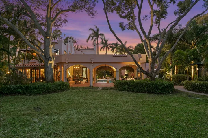Double lot, corner property with immaculate grounds encompassing .43 of an acre. Not on Flood Zone.