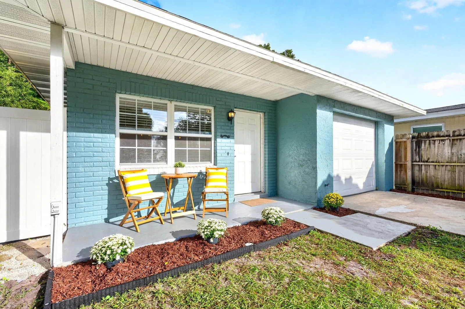 The garage adds another useful feature, with an EPOXY-COATED FLOOR and WINDOW AC UNIT that create a comfortable spot for workouts, hobbies or projects.