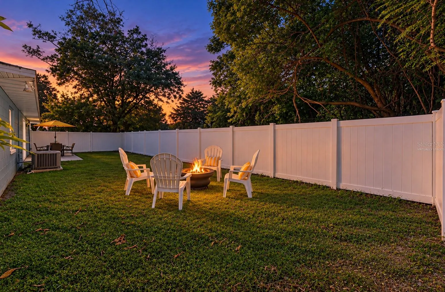 Enjoy the sunset view in your GENEROUS YARD provides room to garden, entertain or simply enjoy a little extra space. *Virtually Staged Twilight*