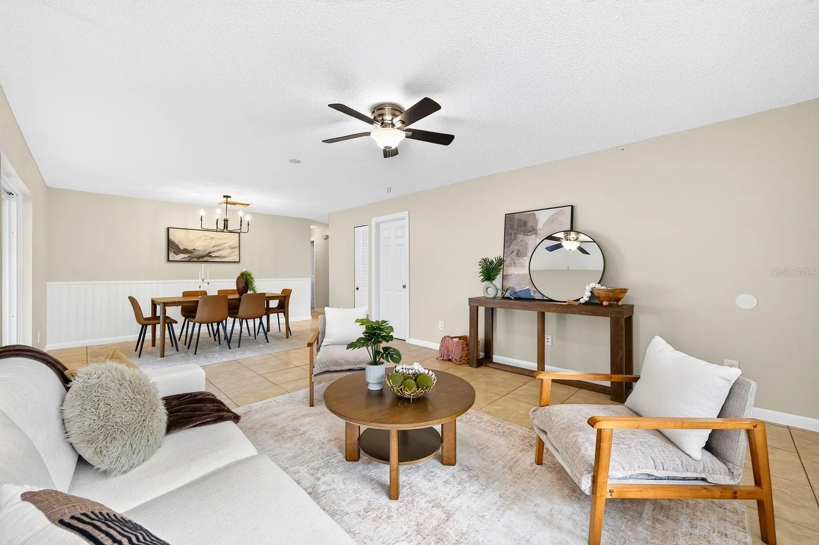 Durable, EASY-CARE TILE FLOORING runs throughout the main living areas.
