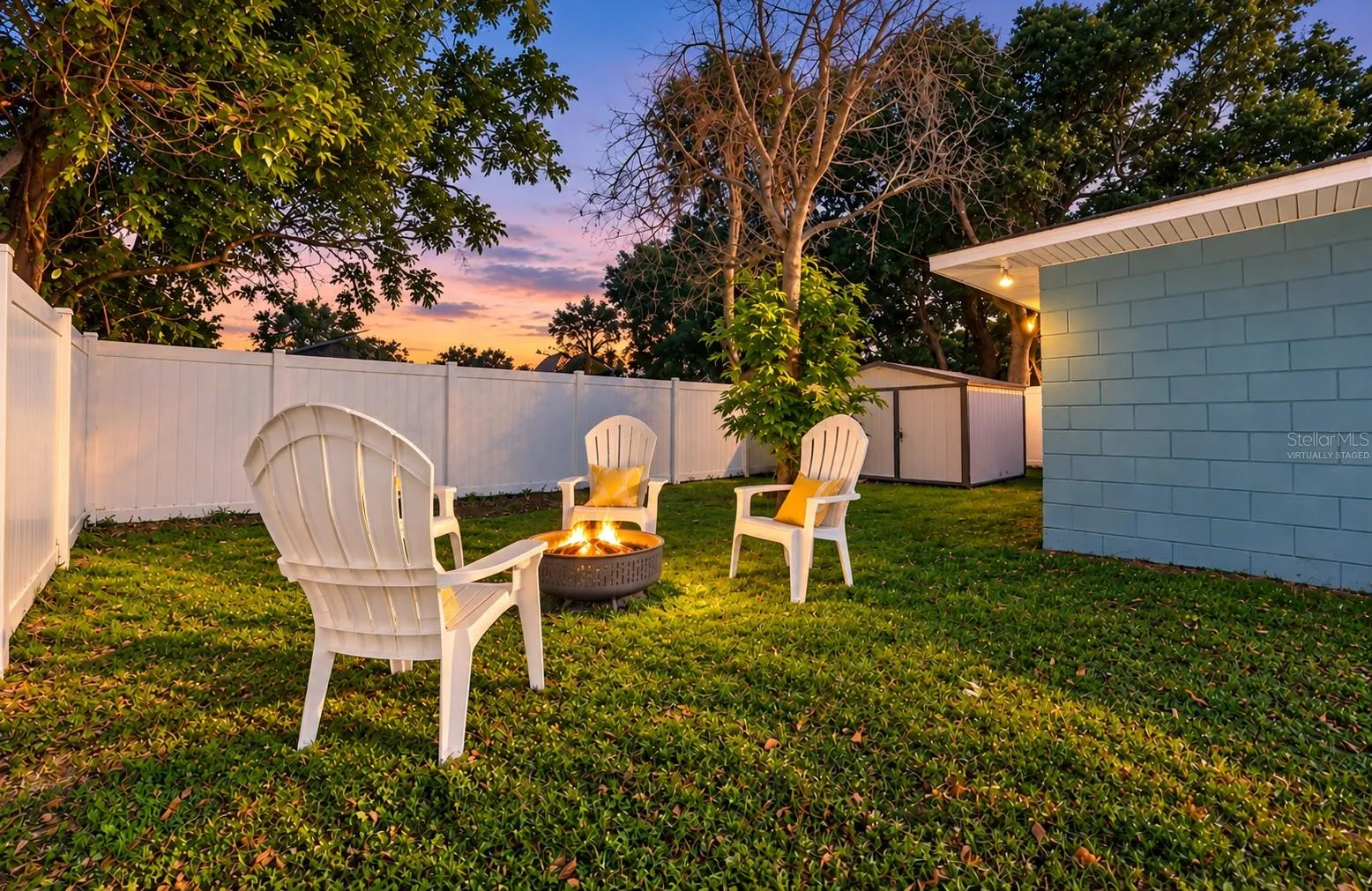 The backyard offers ample space for a fire pit, play set, gardening, or pets to run! *Virtually Staged Twilight*