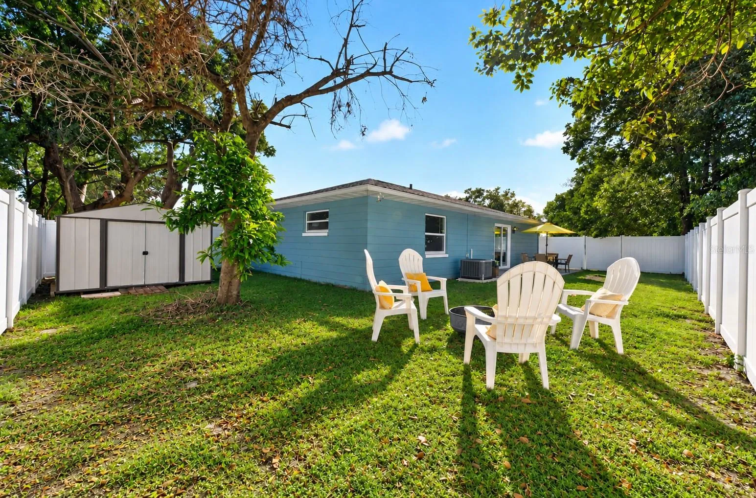 A storage shed in the backyard presents a place to store all your outdoor tools.