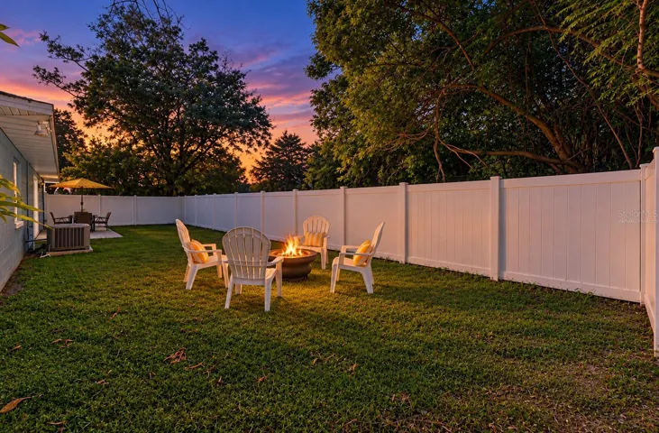Enjoy the sunset view in your GENEROUS YARD provides room to garden, entertain or simply enjoy a little extra space. *Virtually Staged Twilight*
