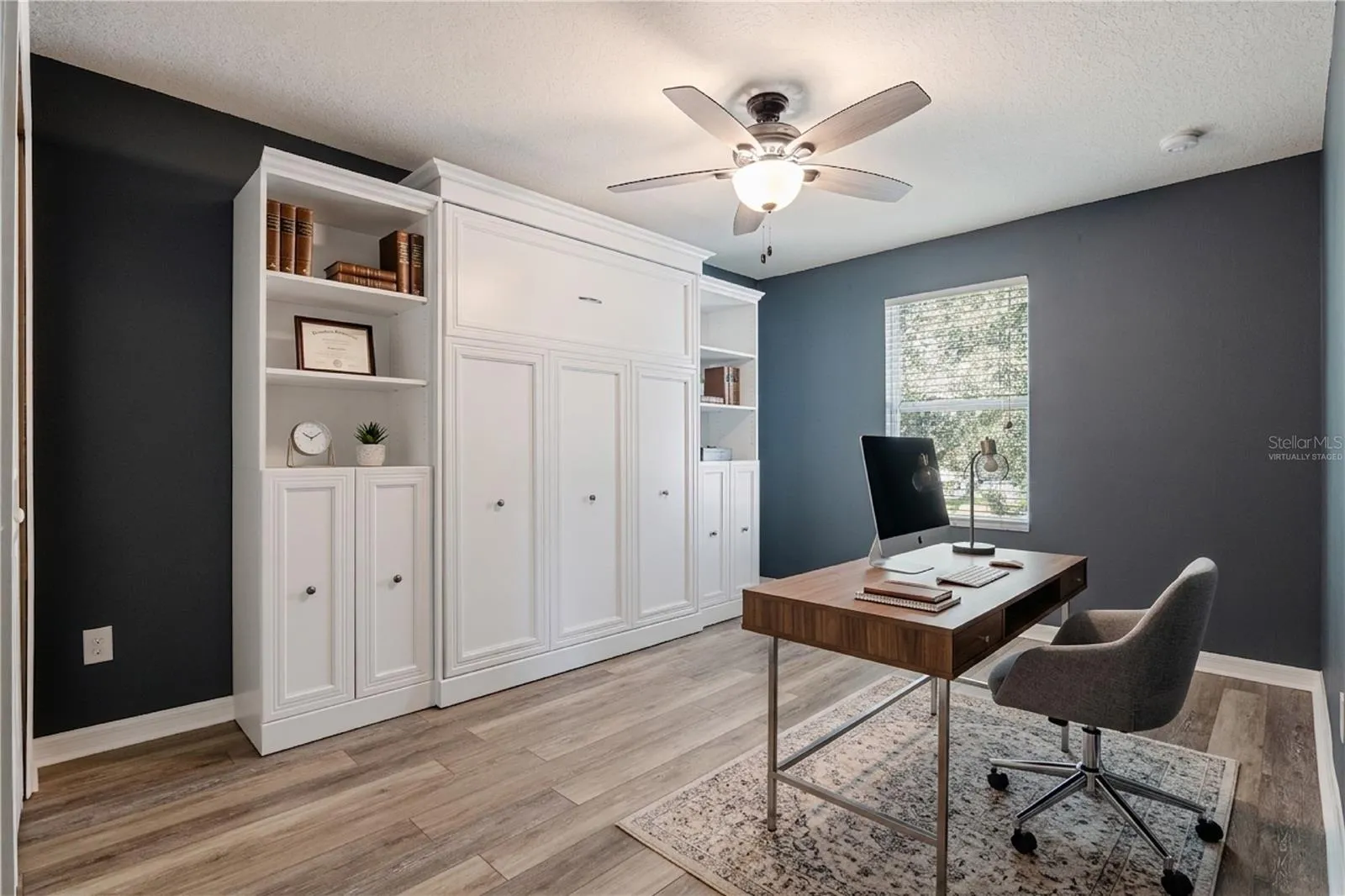 Virtually staged. Bedroom 4 with a murphy bed