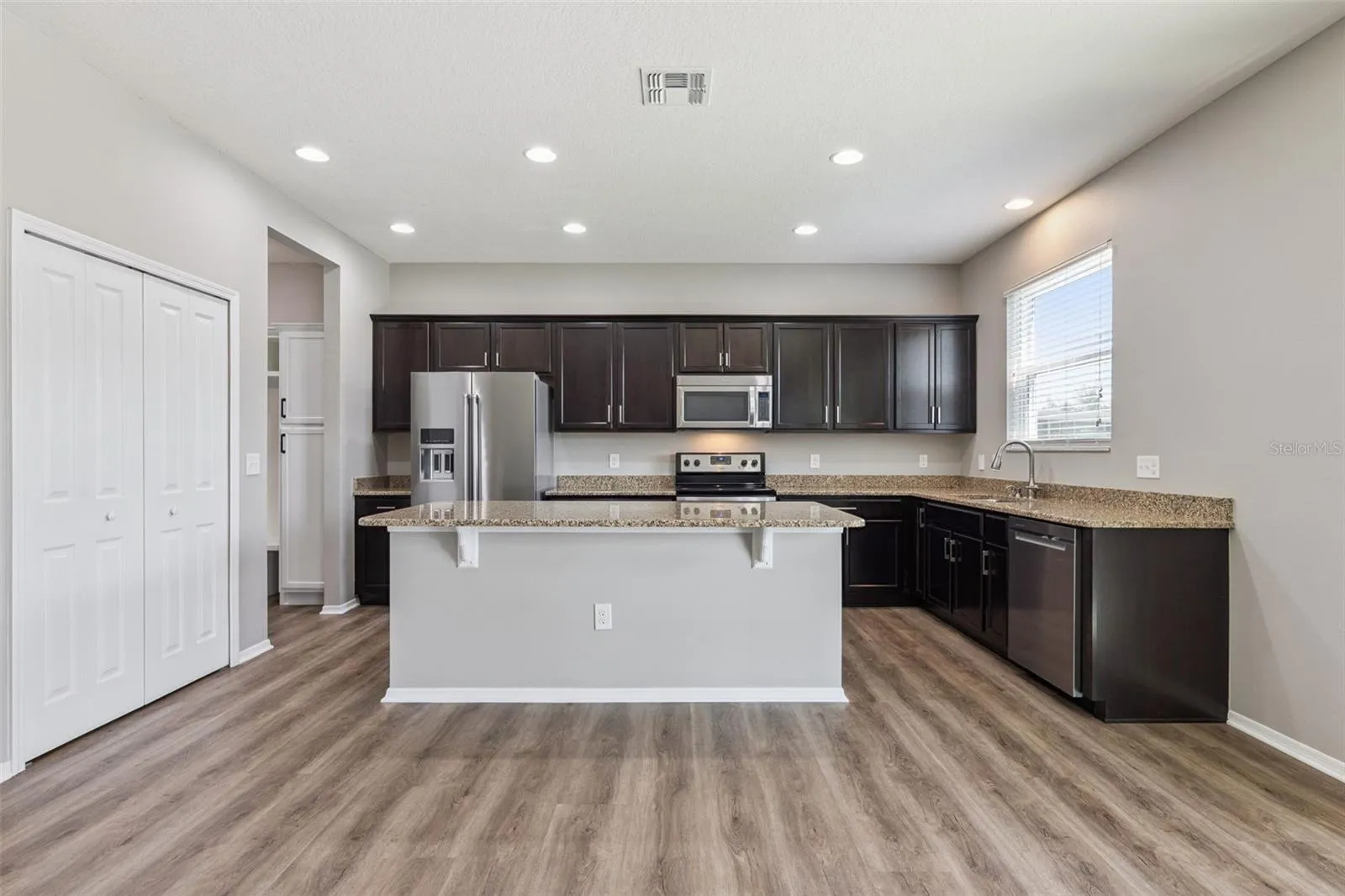 Gourmet kitchen offering ample cabinet & counter space