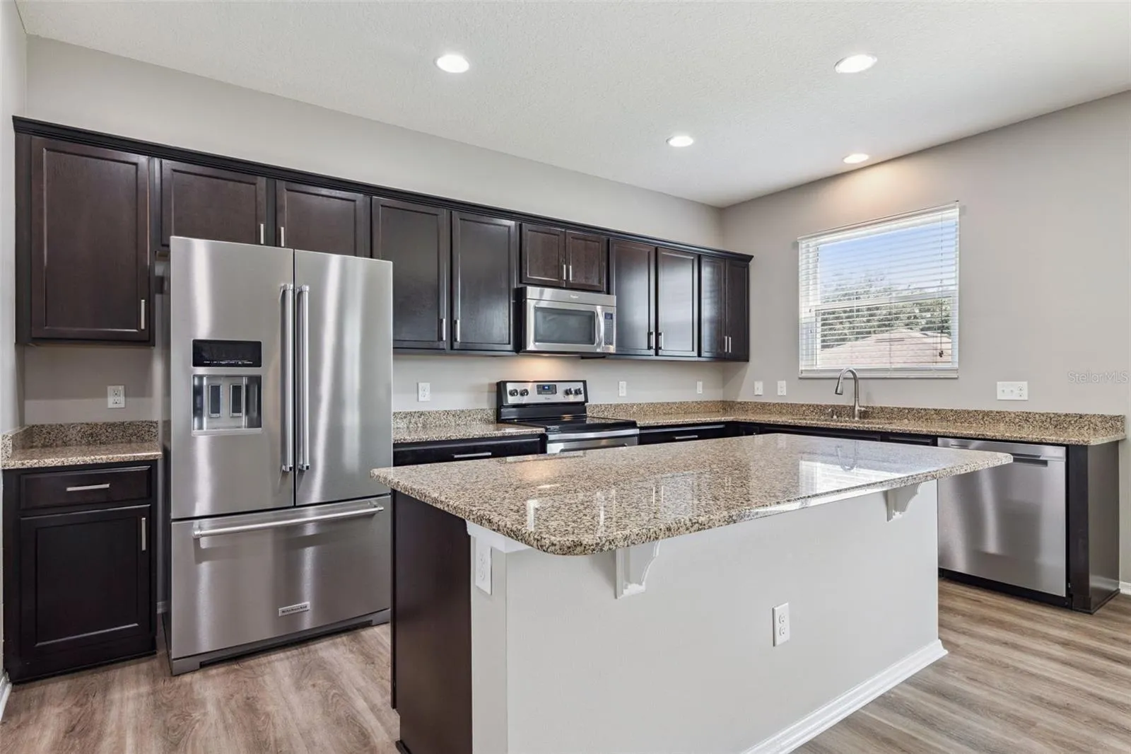 Gourmet kitchen featuring granite counter counter tops