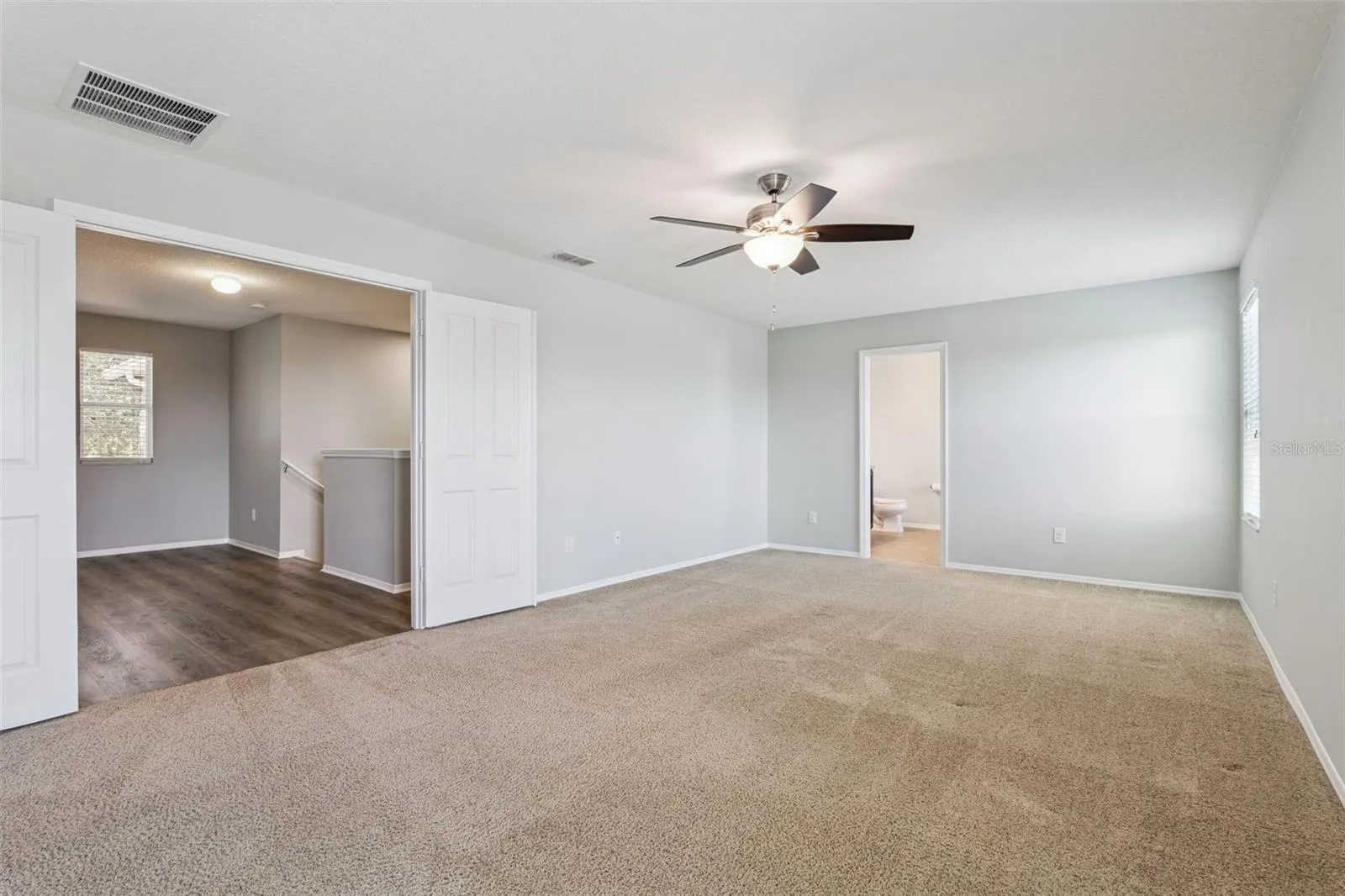 Primary suite with luxurious double door entry