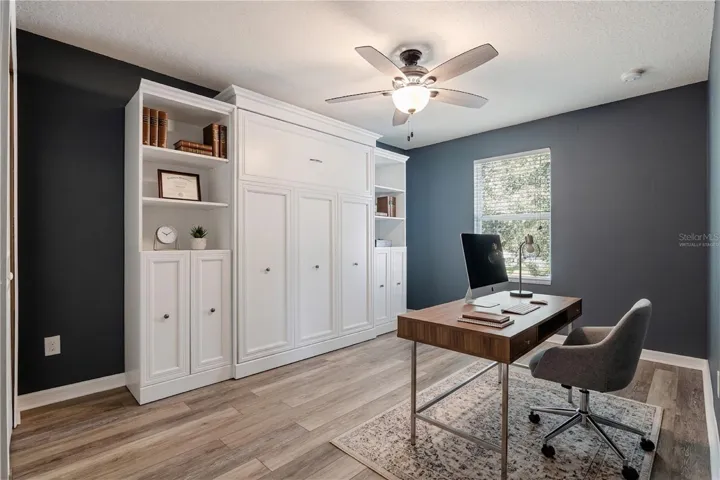 Virtually staged. Bedroom 4 with a murphy bed