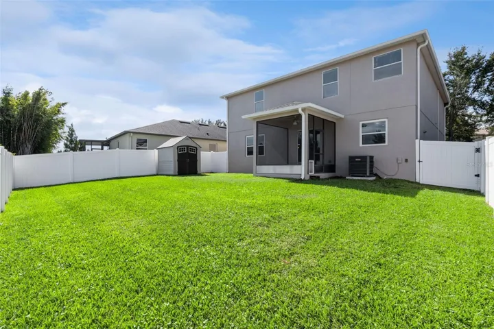 Gorgeous large backyard accented by vinyl fence