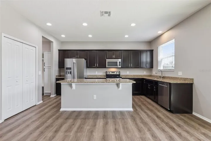 Gourmet kitchen offering ample cabinet & counter space