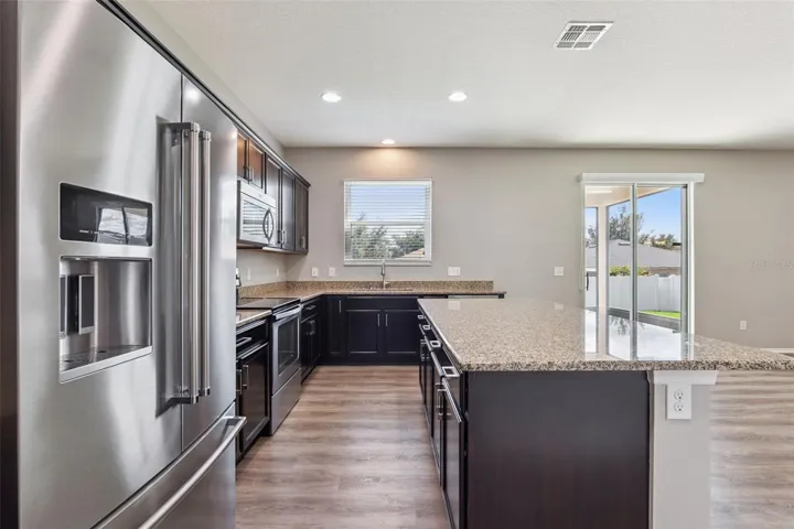 Gourmet kitchen overlooking gorgeous backyard