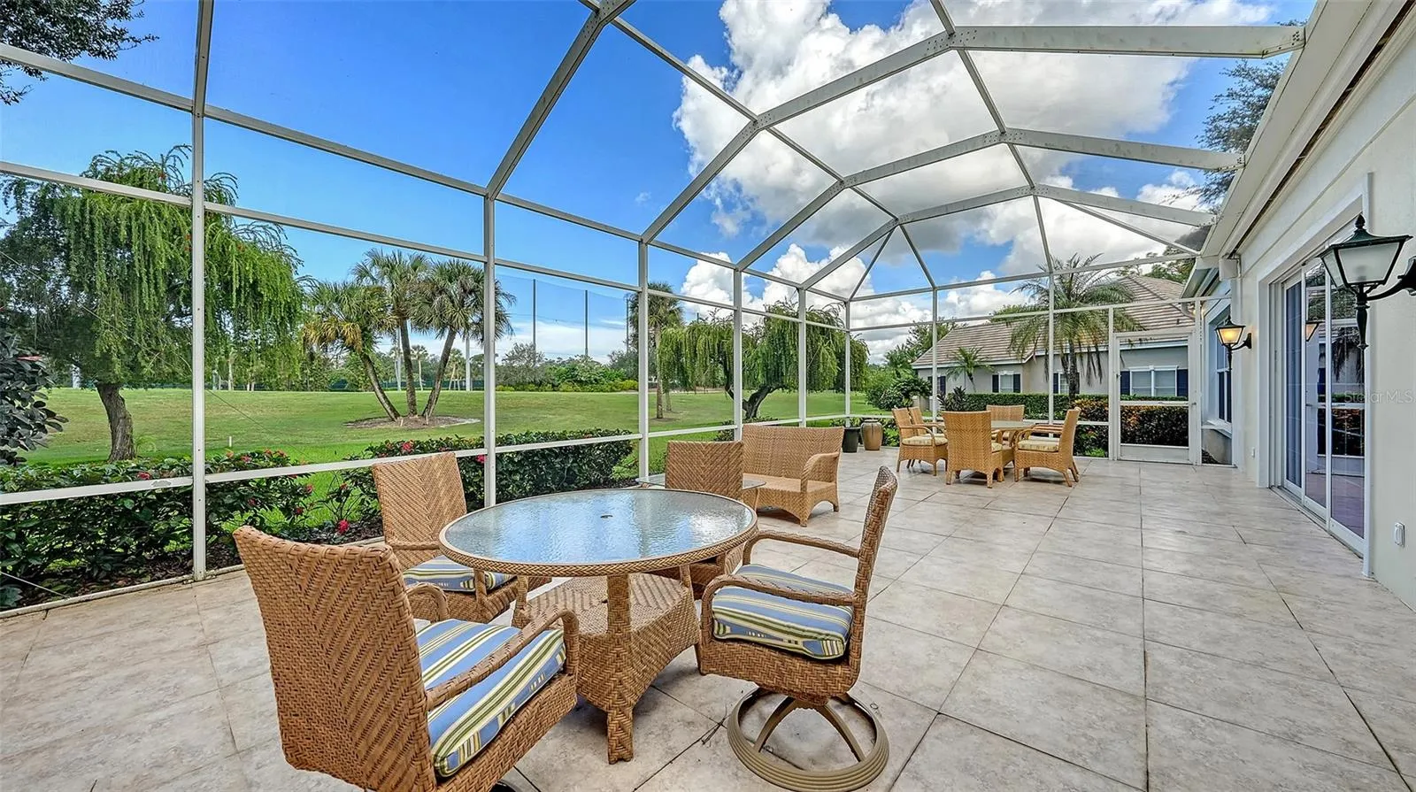 48 x 20 foot Screened and Tiled Lanai Overlooking Eagle Golf Course