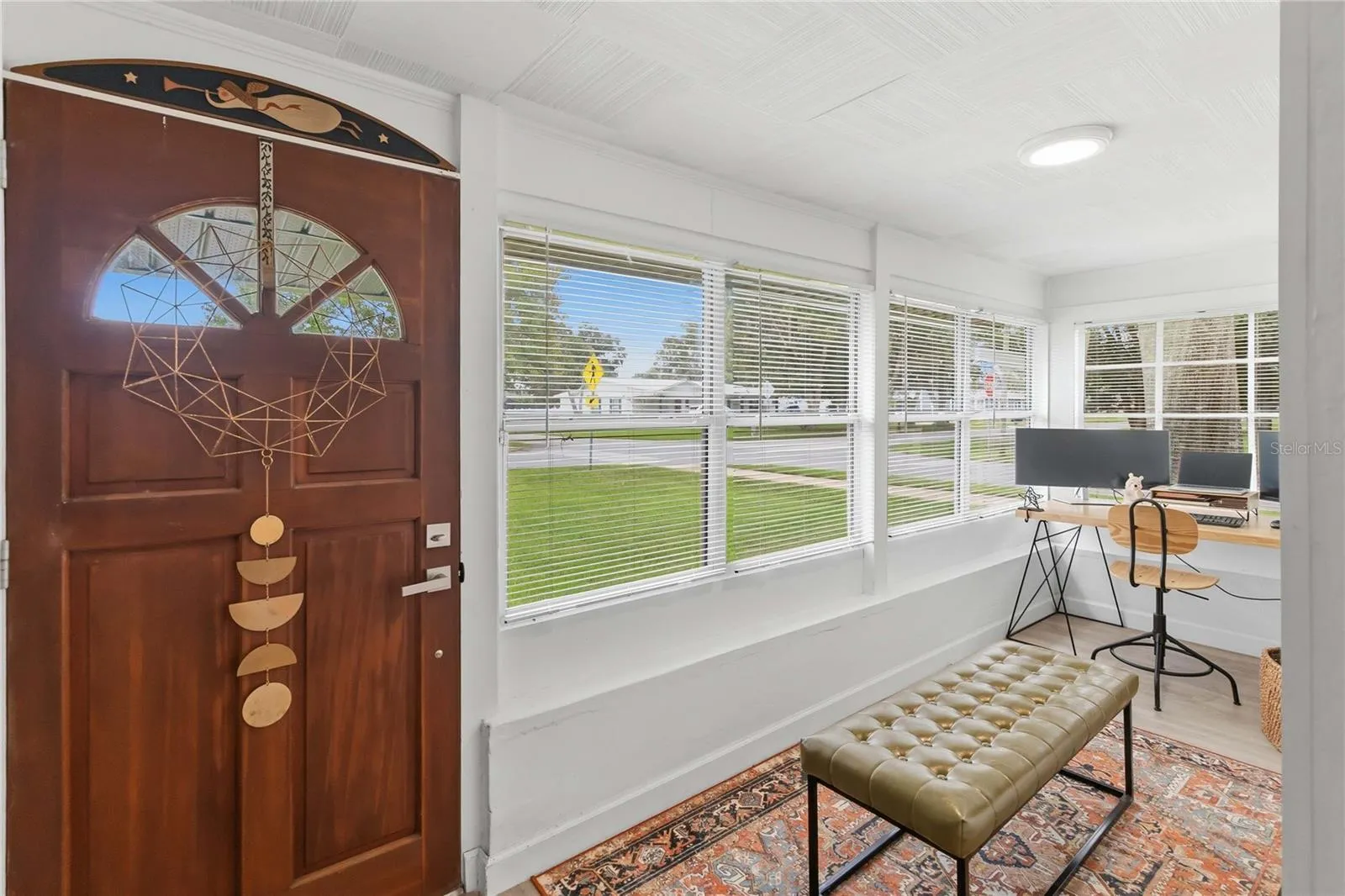 Entry room currently being used as an office.