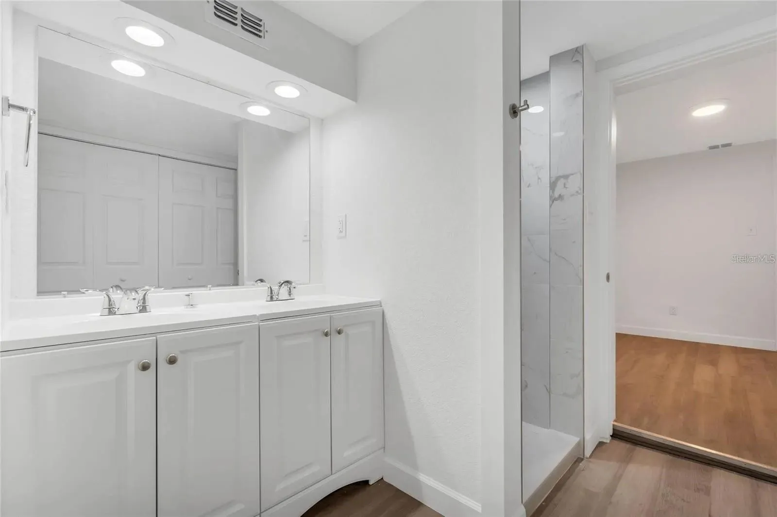 Primary bathroom with dual vanity.