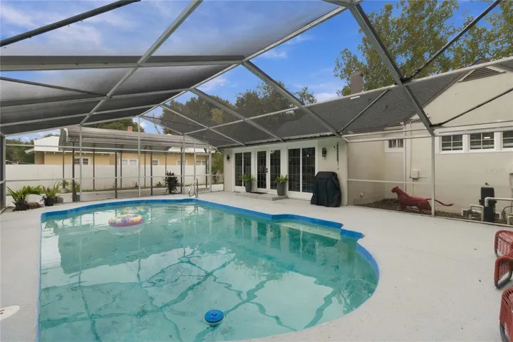 Screened pool with French doors leading inside