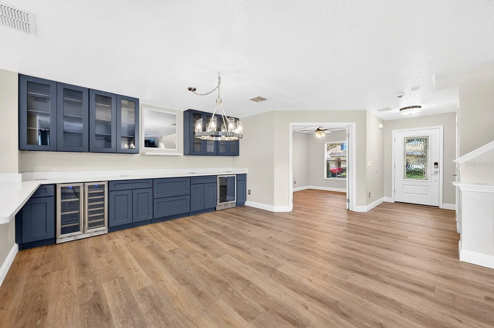 The open plan features an entry with custom glass entry door, full bath, and french doors on the first level open to a versatile FLEX SPACE!
