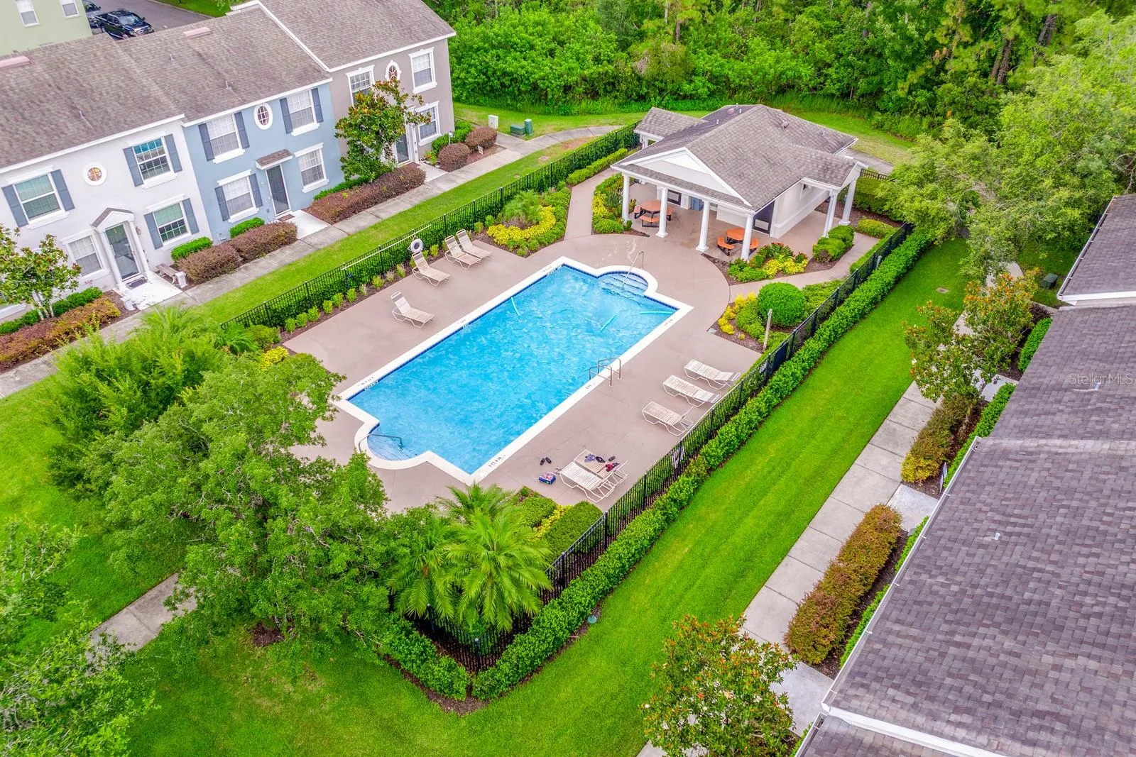 The HOA offers an impressive collection of amenities just steps away, including a SPARKLING COMMUNITY POOL, Clubhouse, DOG PARK, playground and SPORTS COURTS.