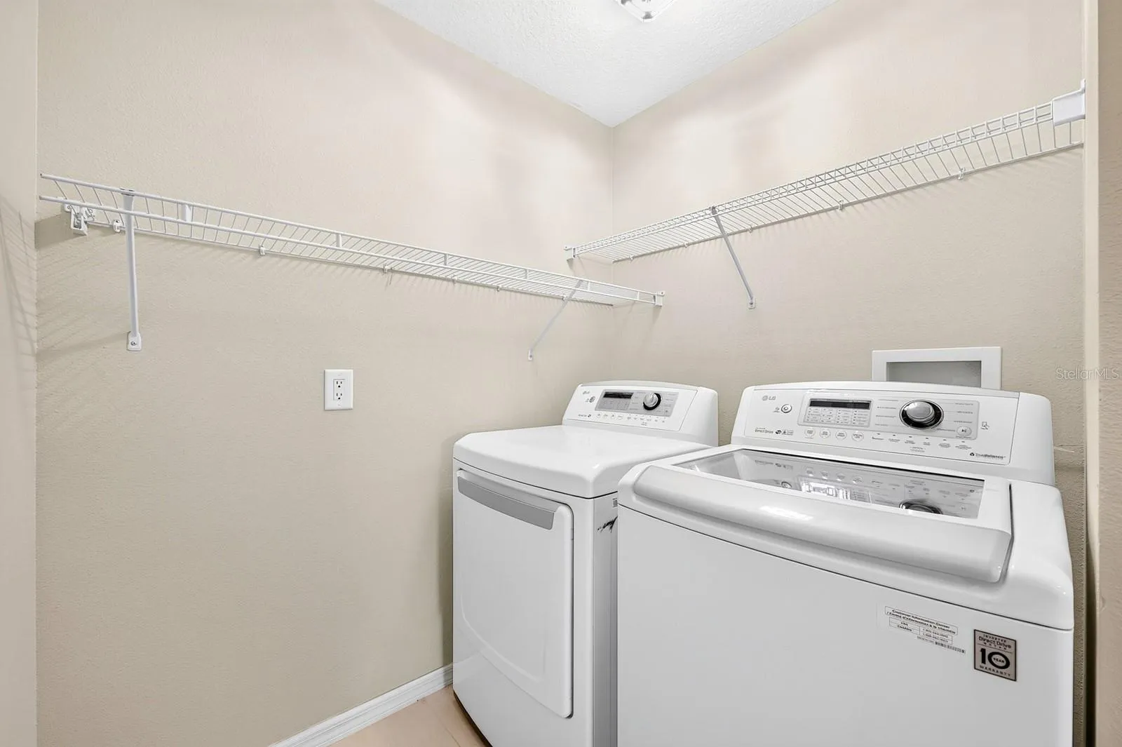 An upstairs Laundry Room is equipped with an included washer and dryer.
