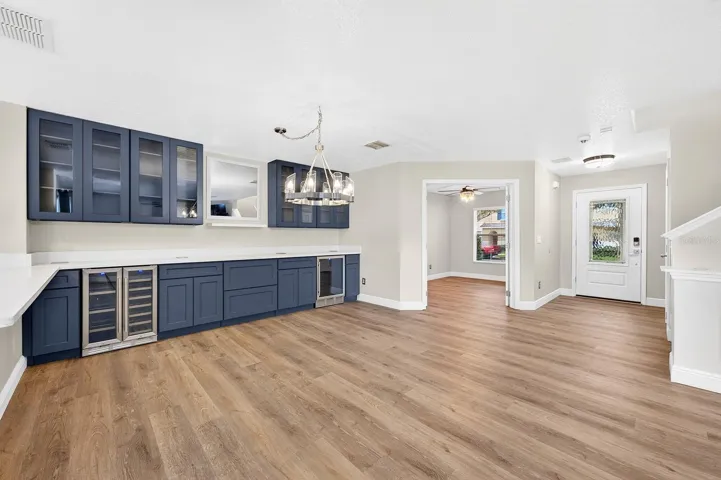 The open plan features an entry with custom glass entry door, full bath, and french doors on the first level open to a versatile FLEX SPACE!