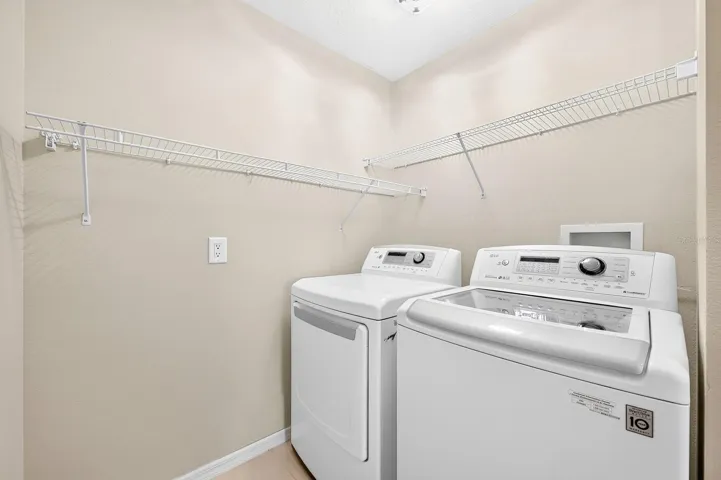 An upstairs Laundry Room is equipped with an included washer and dryer.