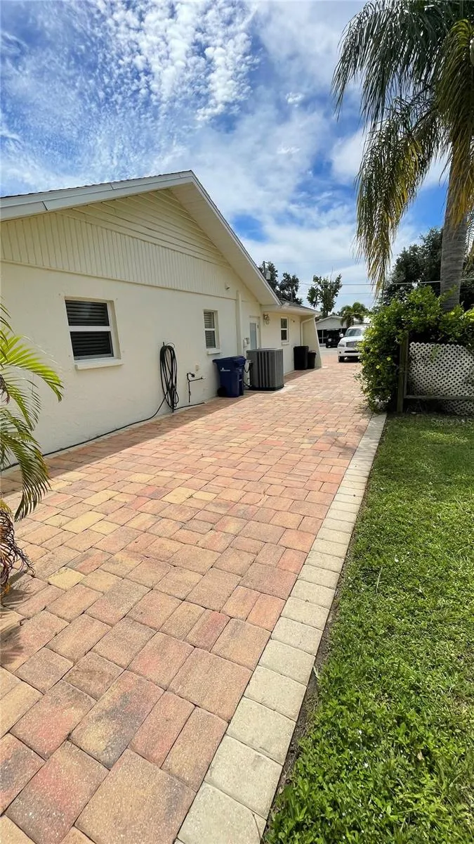 Pavers run along side of home.