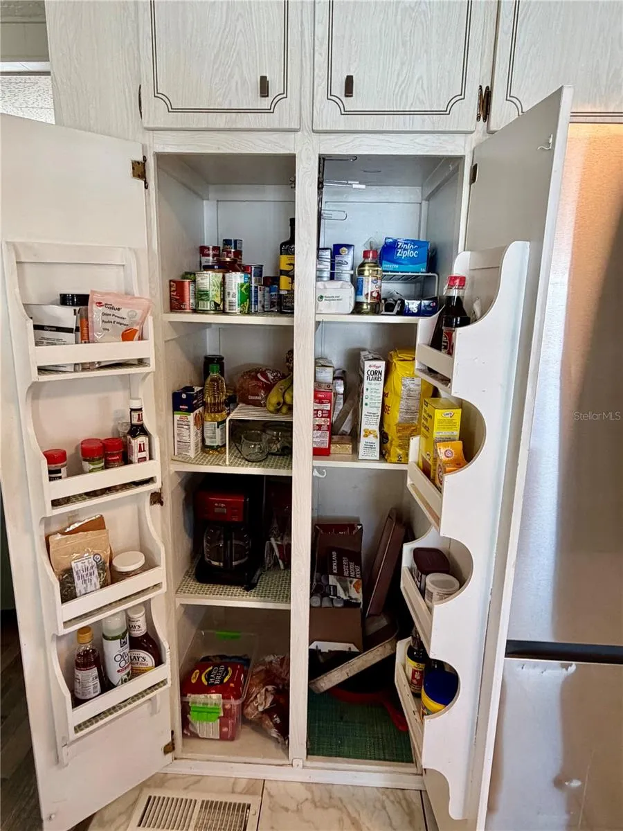 Pantry next to the refrigerator