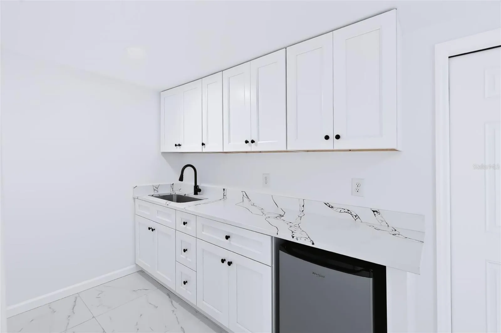 Kitchen with mini fridge