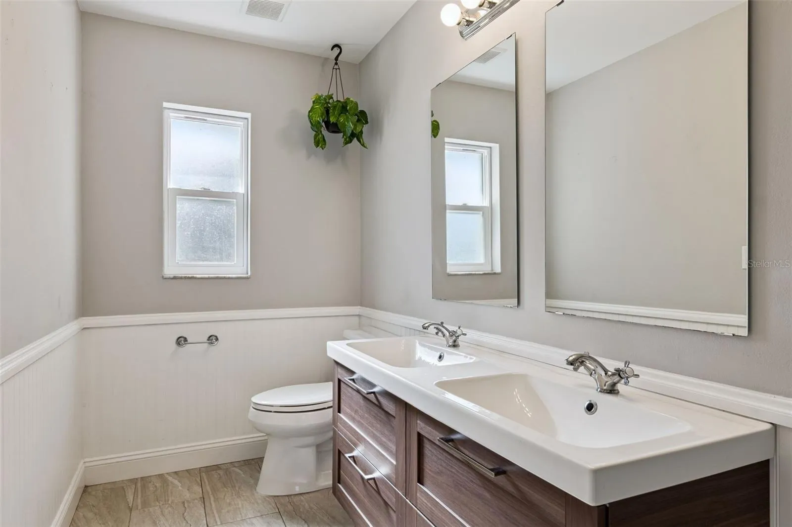 Double vanity with crisp beadboard accents