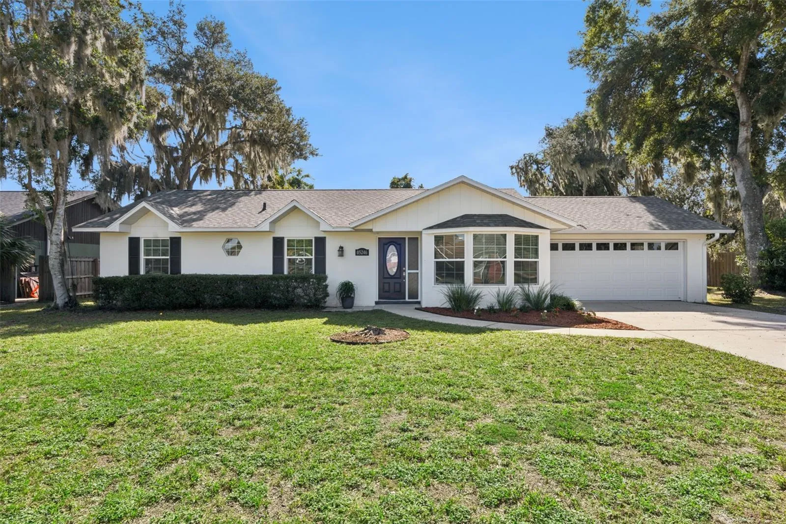 Welcome to 5246 Royal Oak Drive, a bright pool home under moss-draped live oaks