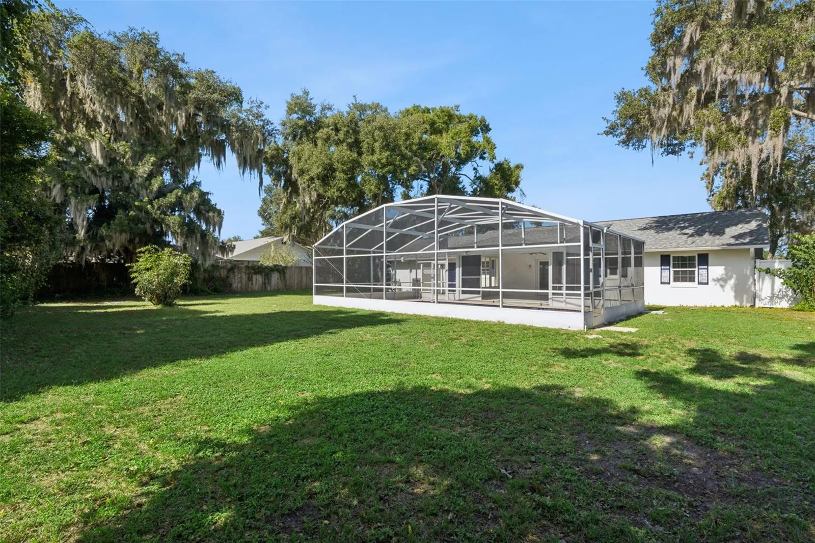 Wide open lawn under a blue Florida sky