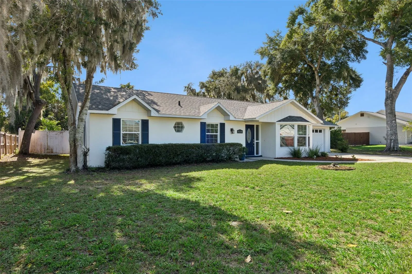 Classic curb appeal with navy shutters and a welcoming front door