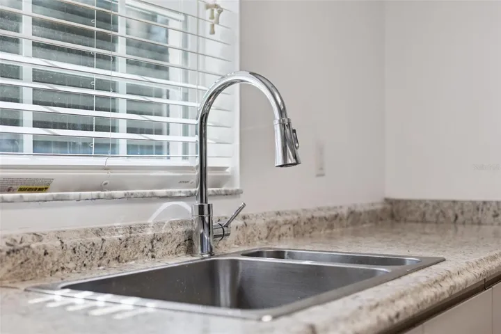 Laminate counters and a modern pull-down faucet