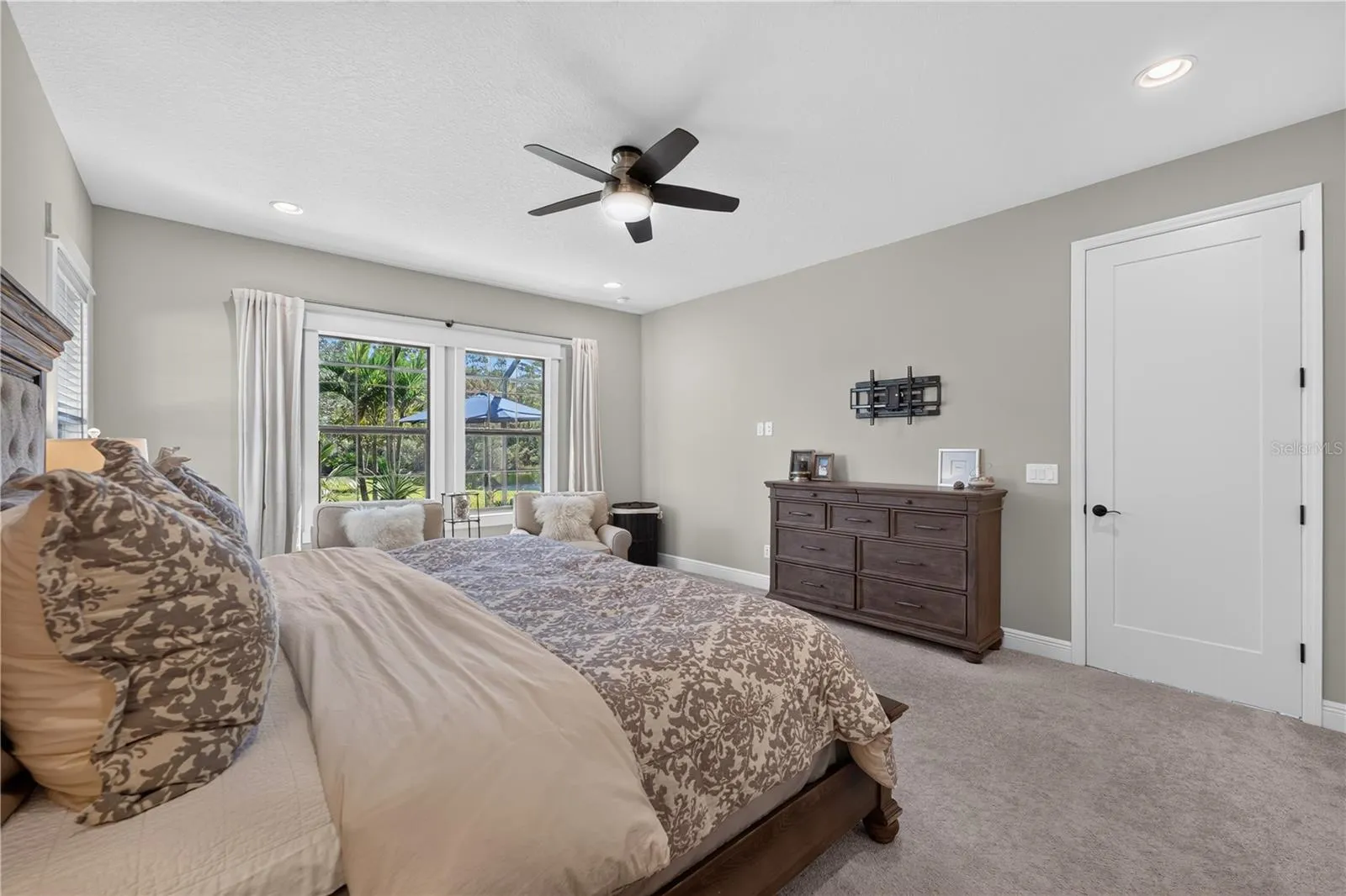 Primary Suite with views of the pool and conservation.