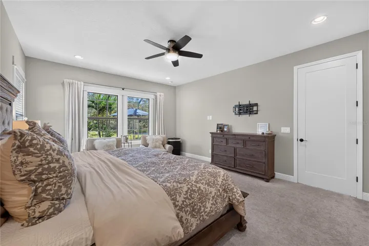 Primary Suite with views of the pool and conservation.
