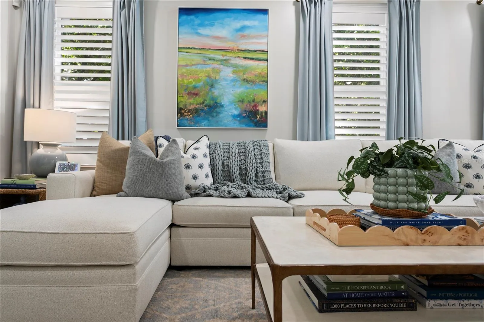 Layered window treatments with shutters and drapery