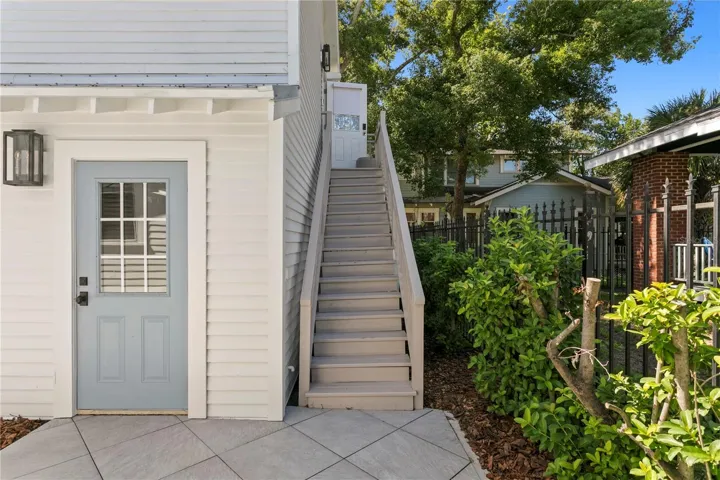 Door to the 2 car garage, Stairs lead to the Guest House