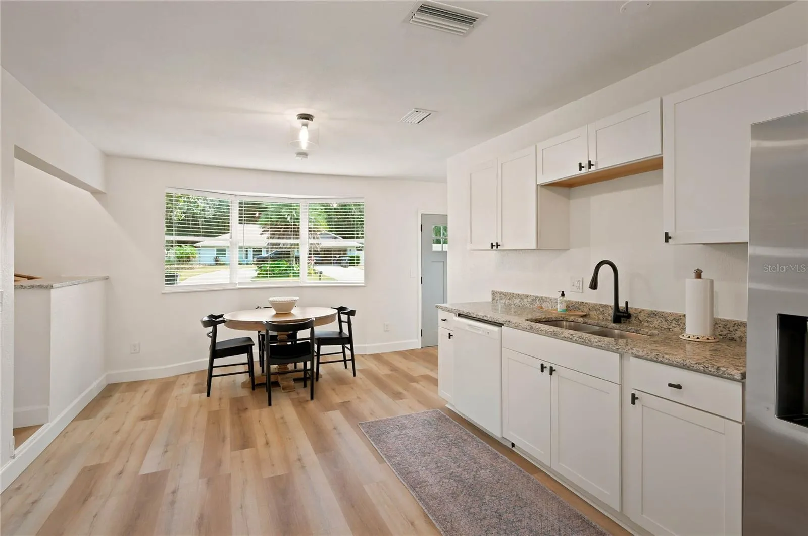 kitchen to dining and bay window to front