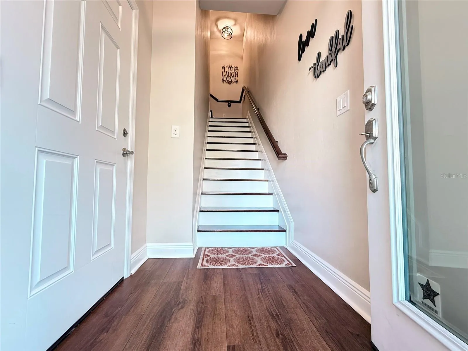 Entry into the front door, garage door entry on the left.