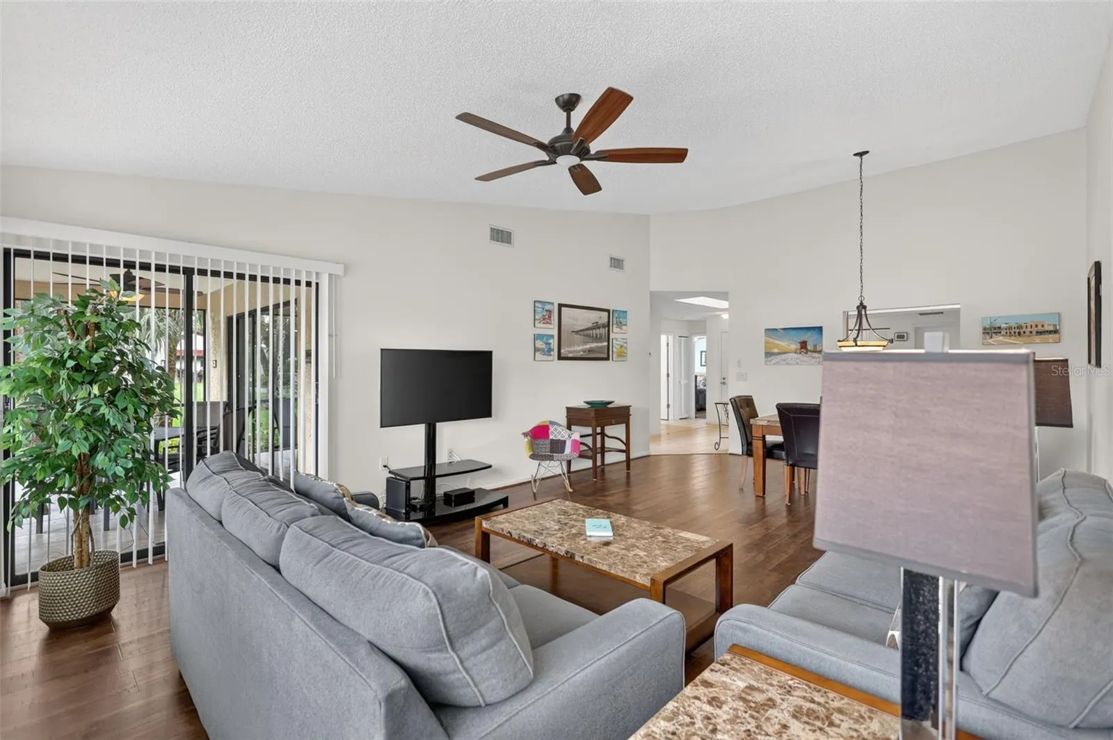 Living Room features sliding doors leading to the lanai