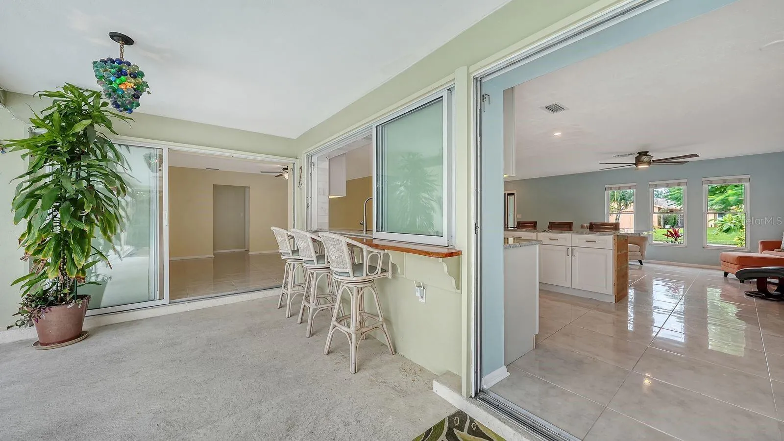 Exterior Bar with a Sliding Pass Thru Window to the Kitchen