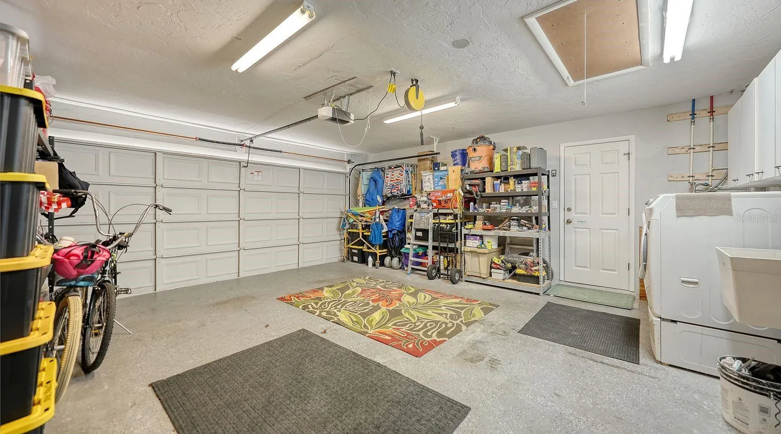 Spacious 2 Car Garage and a aluminum pull-down stairs to the attic.