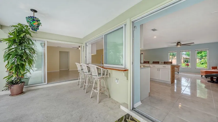 Exterior Bar with a Sliding Pass Thru Window to the Kitchen
