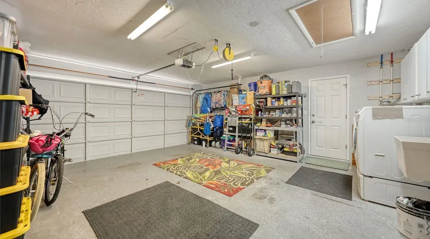 Spacious 2 Car Garage and a aluminum pull-down stairs to the attic.