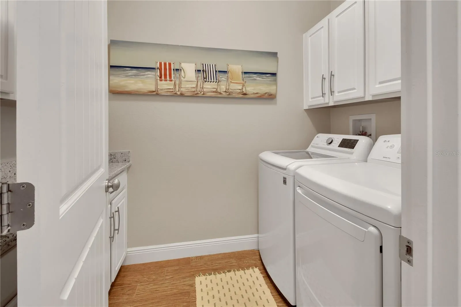 Laundry room with tons of cabinets and folding counter