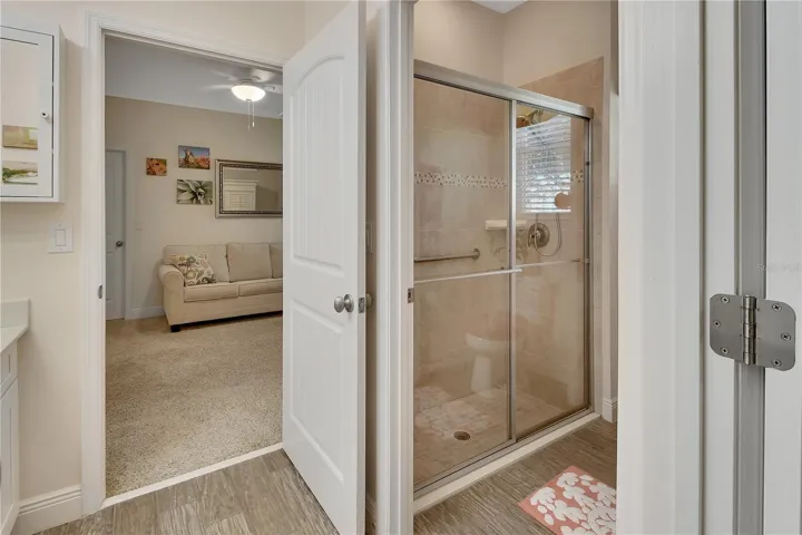 Walk-in shower with grab bar