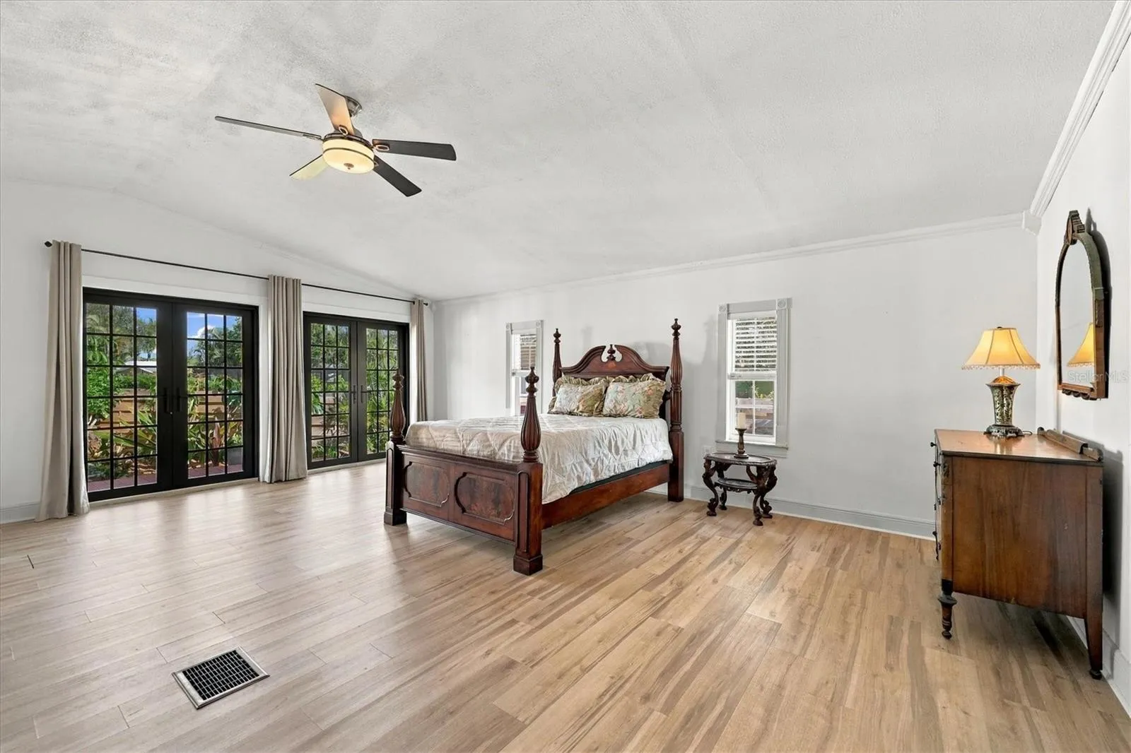 Primary Bedroom with french doors to the outdoor patio